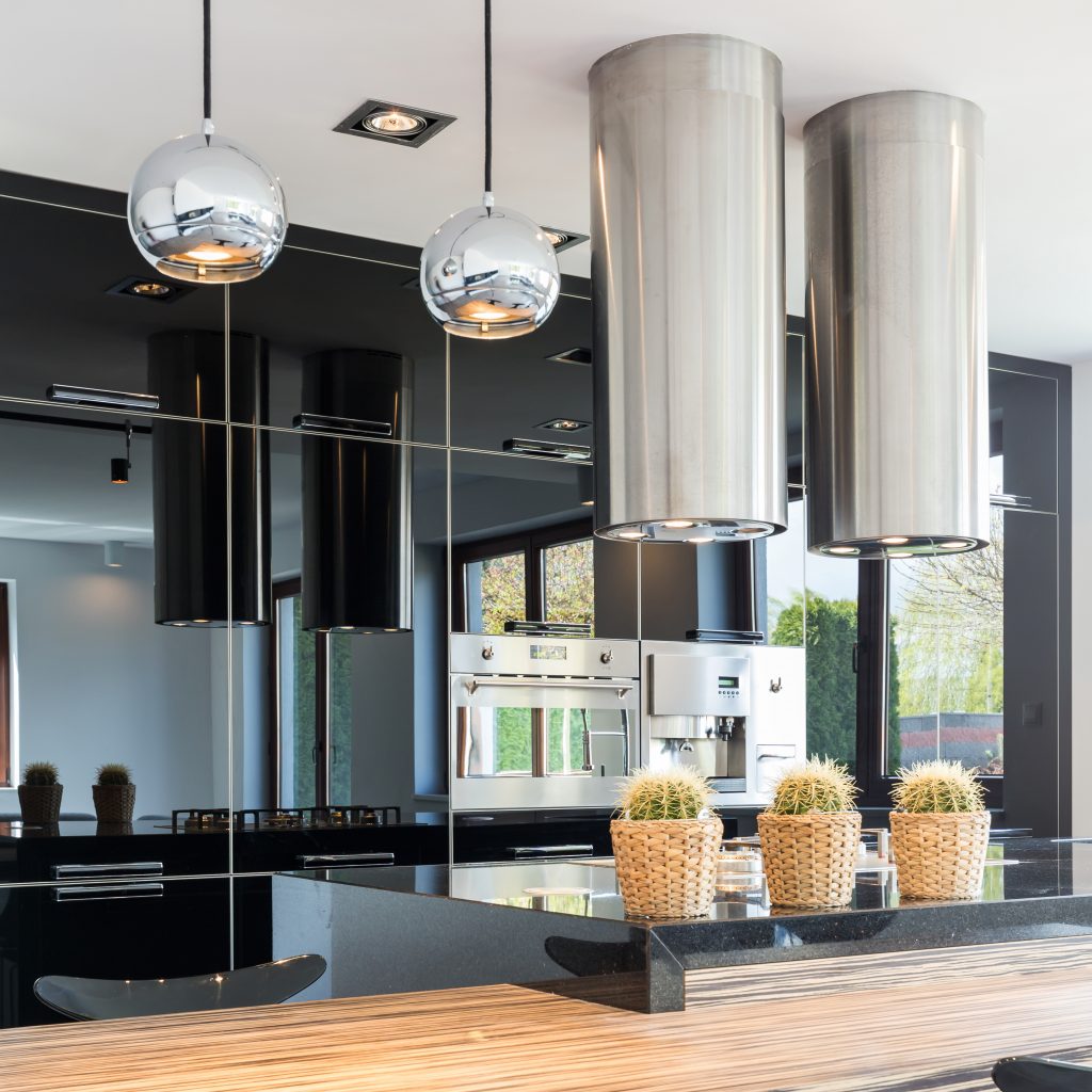 New design black open kitchen with stylish built-in cabinets